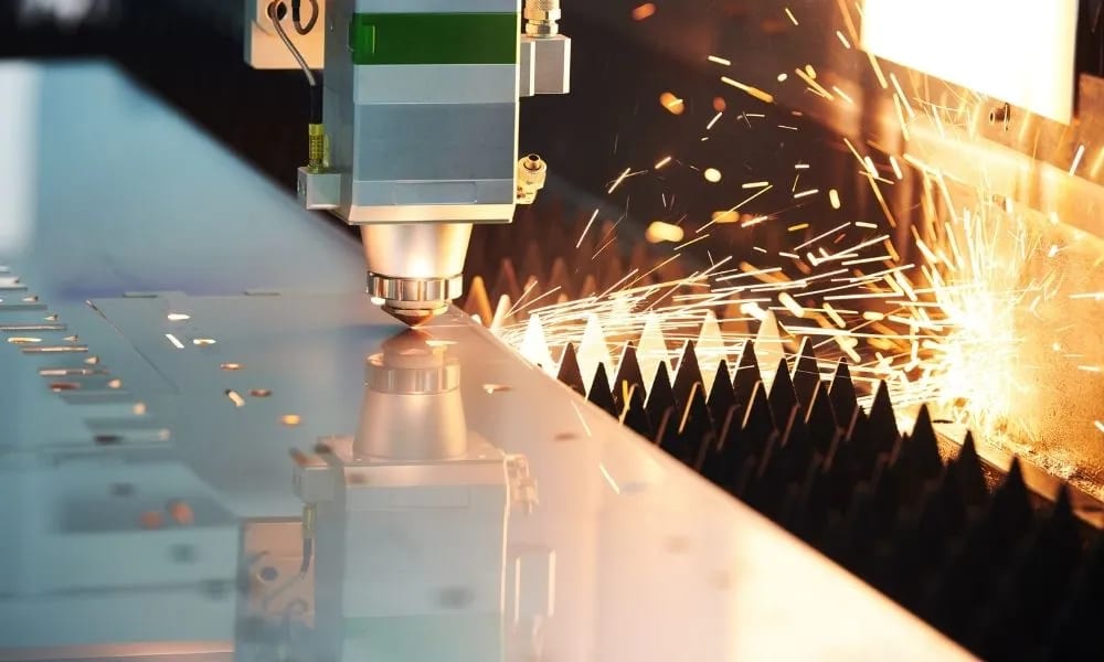Benefits of laser cutting shown on a clean fiber laser cut metal part