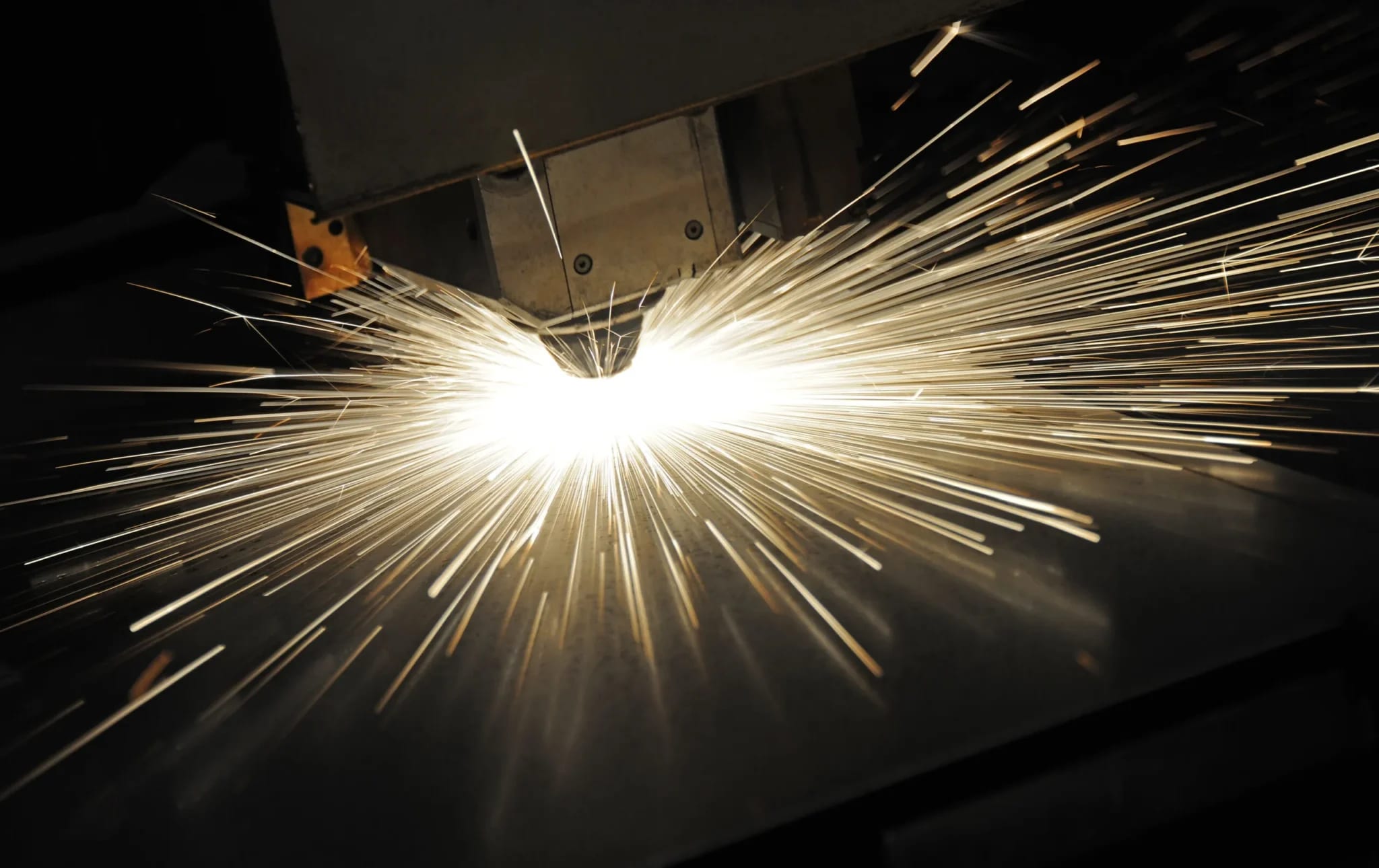 What is a laser cutting machine shown cutting sheet metal