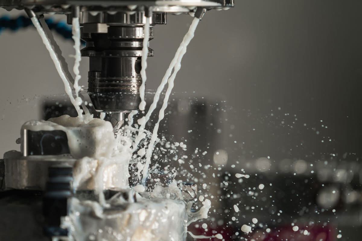 Coolant flooding a machine spindle, the same flow a fiber laser chiller has to keep stable